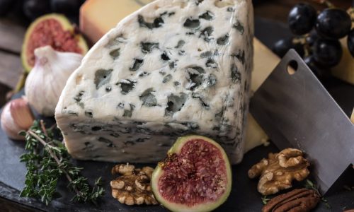 Artisan cheese board with grapes and figs