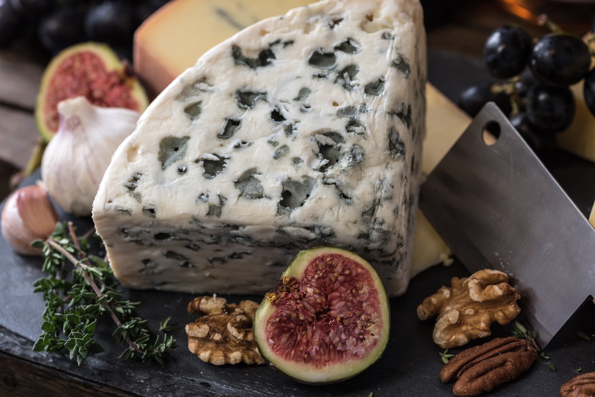 Artisan cheese board with grapes and figs