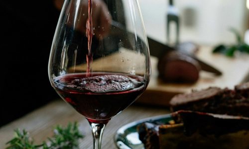 Pouring wine with a gourmet food board